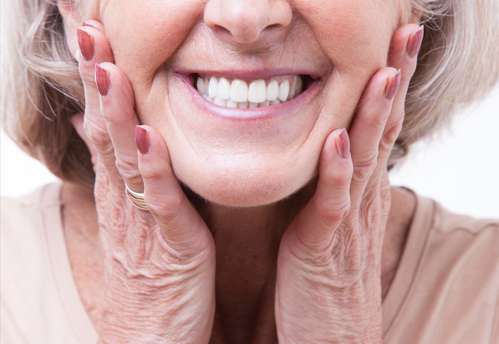 Woman smiling with her new dentures from Chesterfield Dental Studio in Chesterfield Missouri